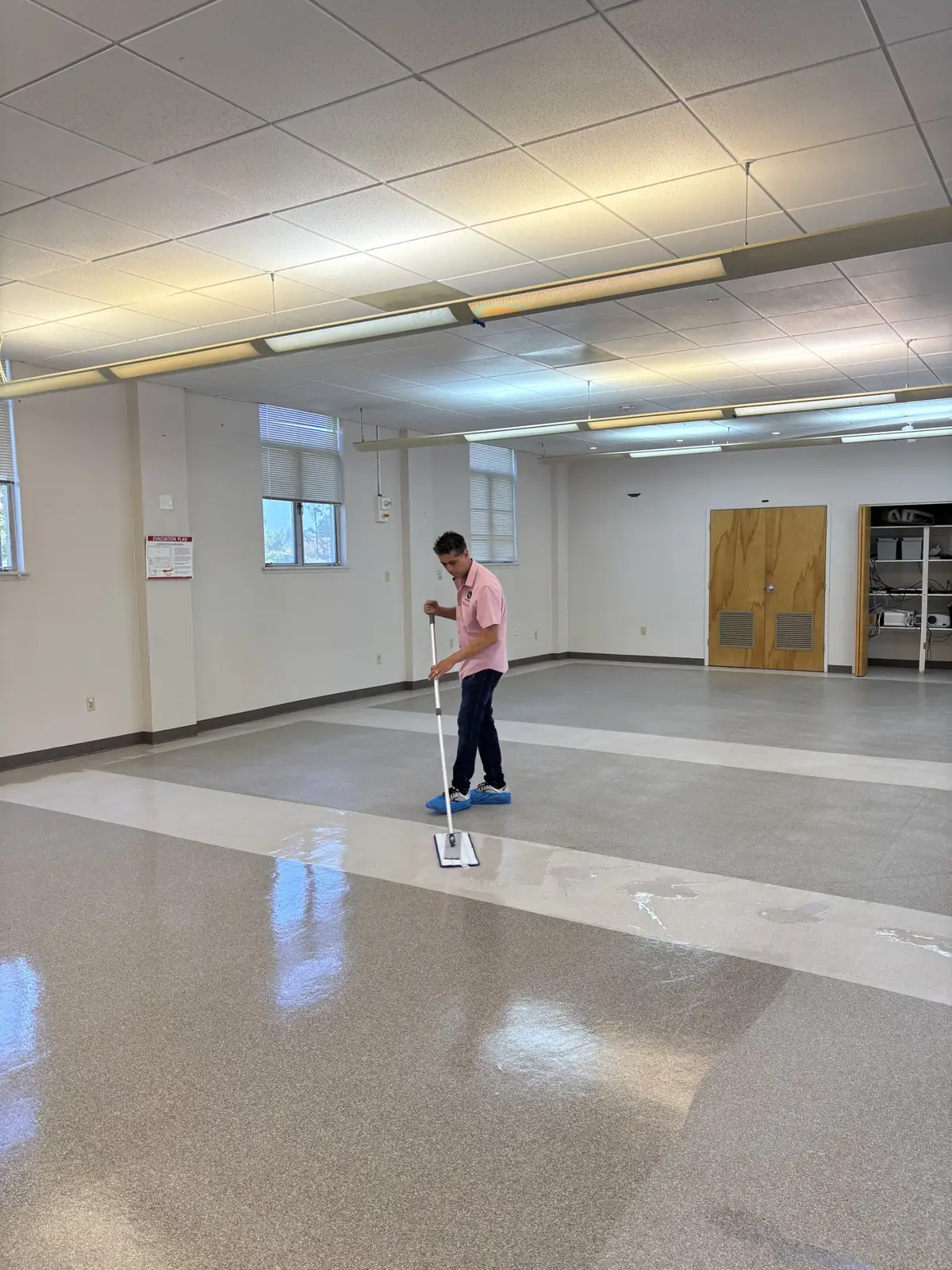Applying floor finish in a meeting room