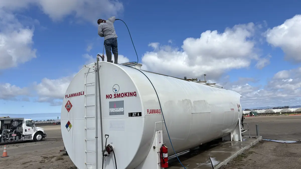Pressure washing a large fuel storage tank