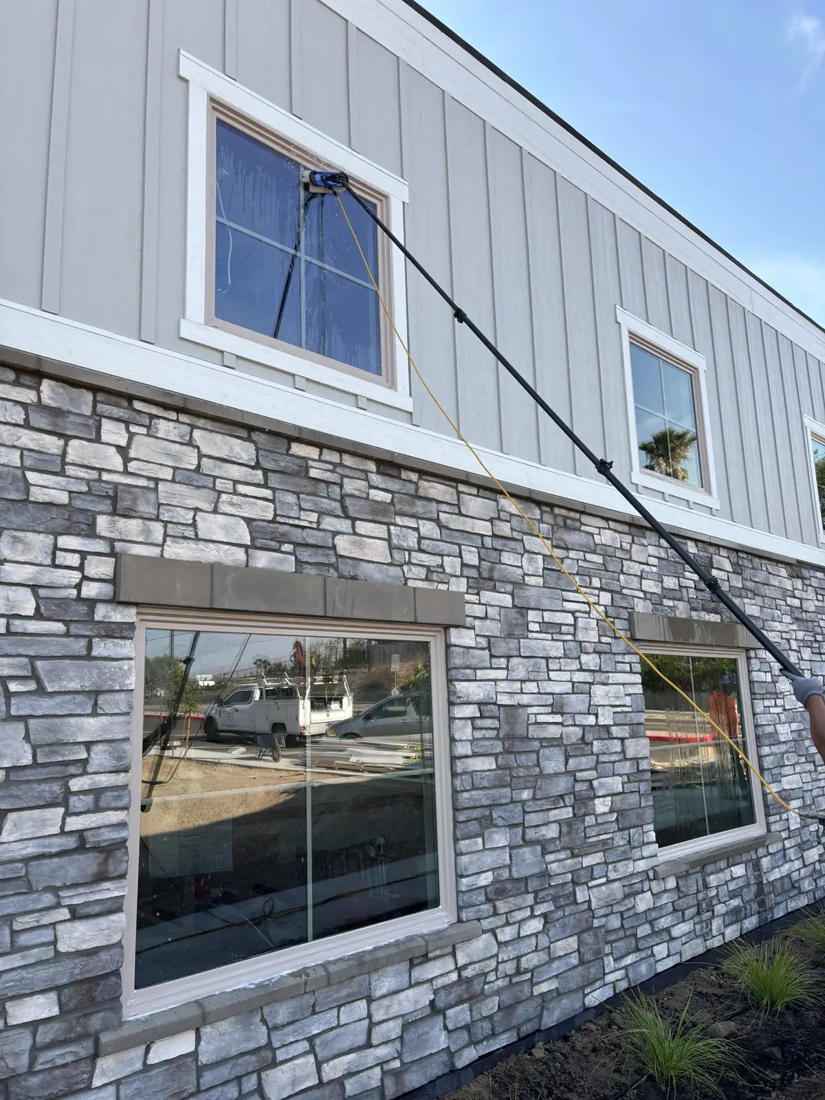 Cleaning second story windows on a new building