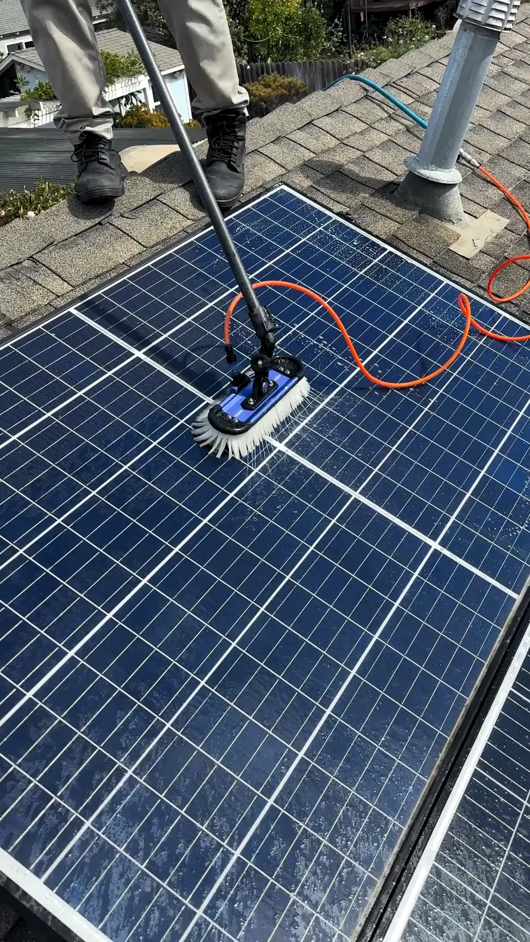 Washing rooftop solar panels