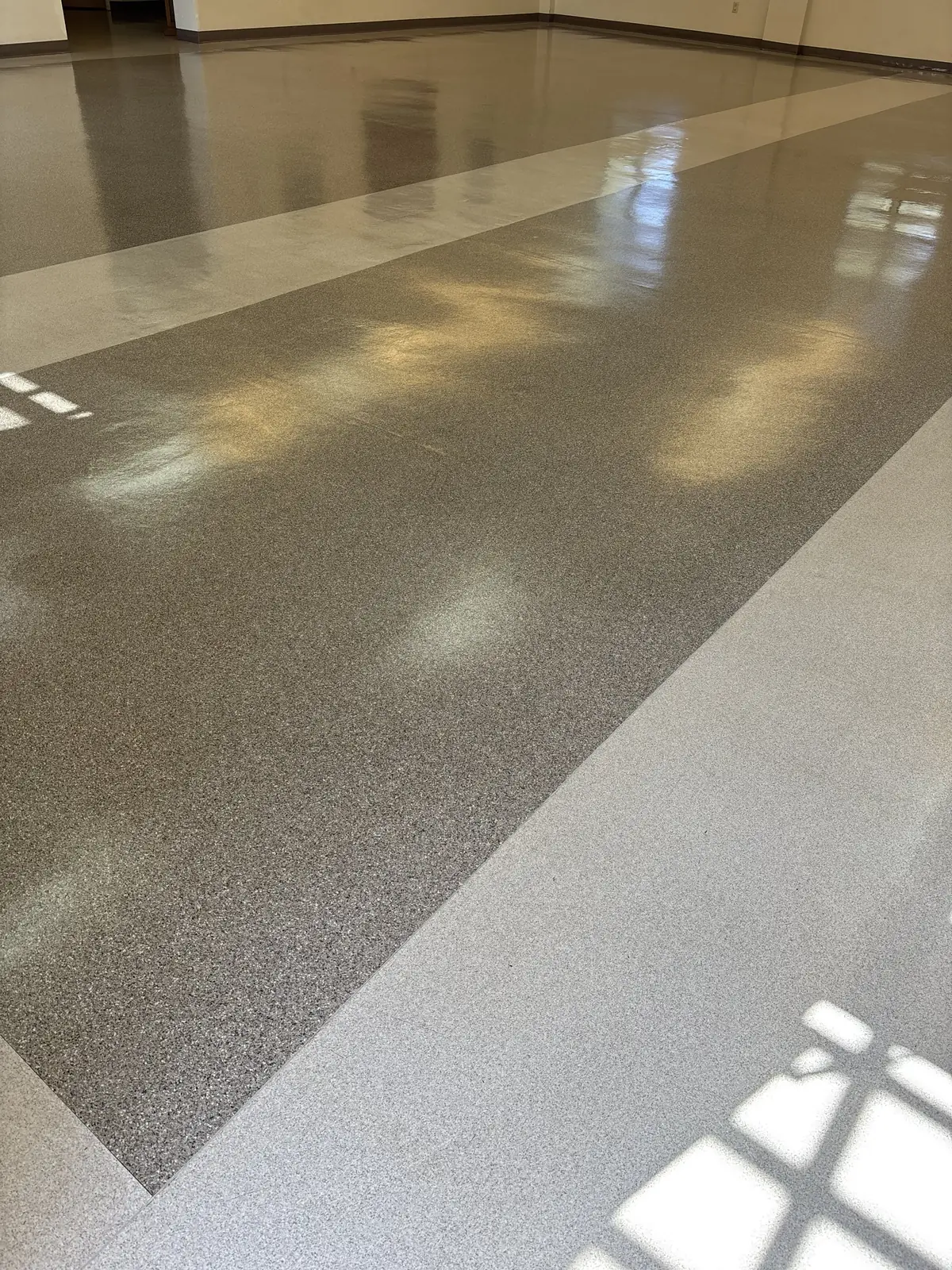 Freshly waxed commercial vinyl tile floor with a high shine